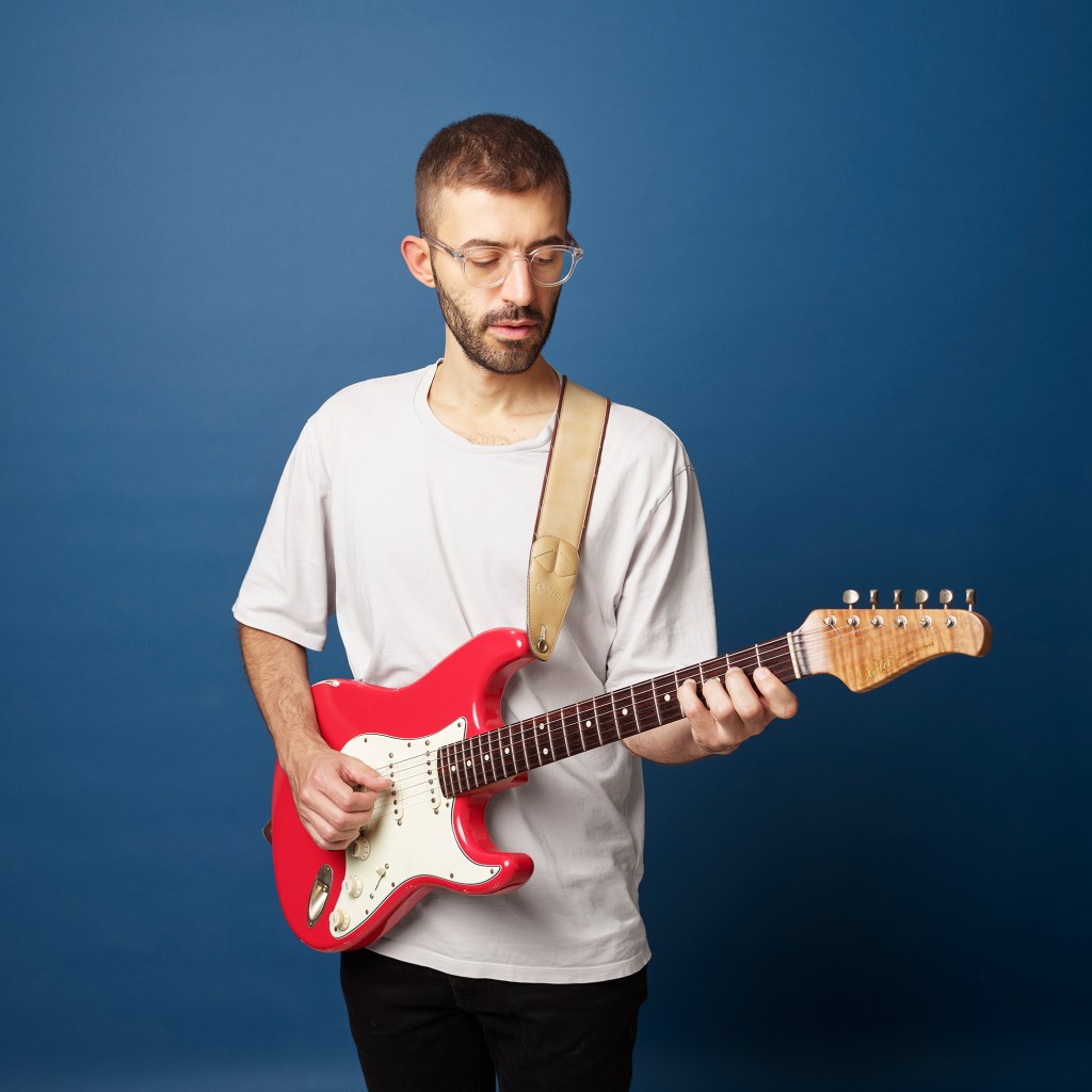 Playing and electric guitar like a Fender Stratocaster